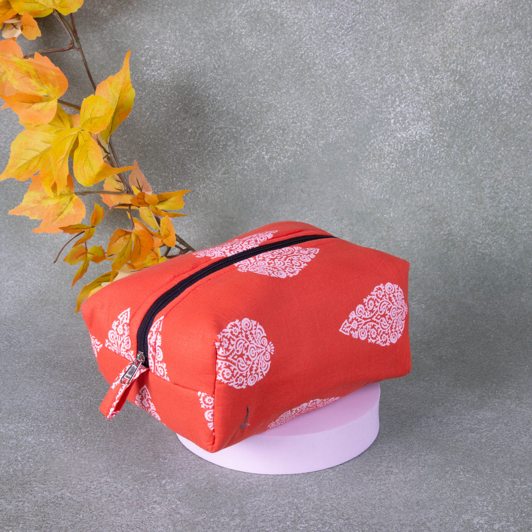 Vanity Pouch Orange Colour With White Big Flower Design.