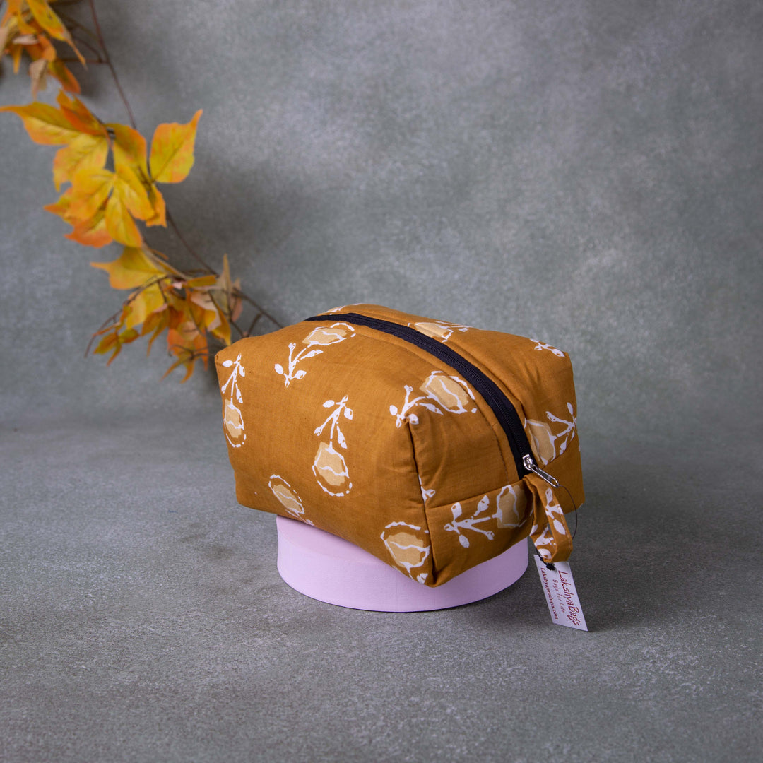 Vanity Pouch Golden Brown Colour with White and Sandal Flower Design.