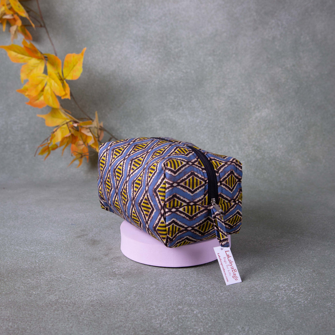 Vanity Pouch Grey with Yellow and Black Symmetrical Design.