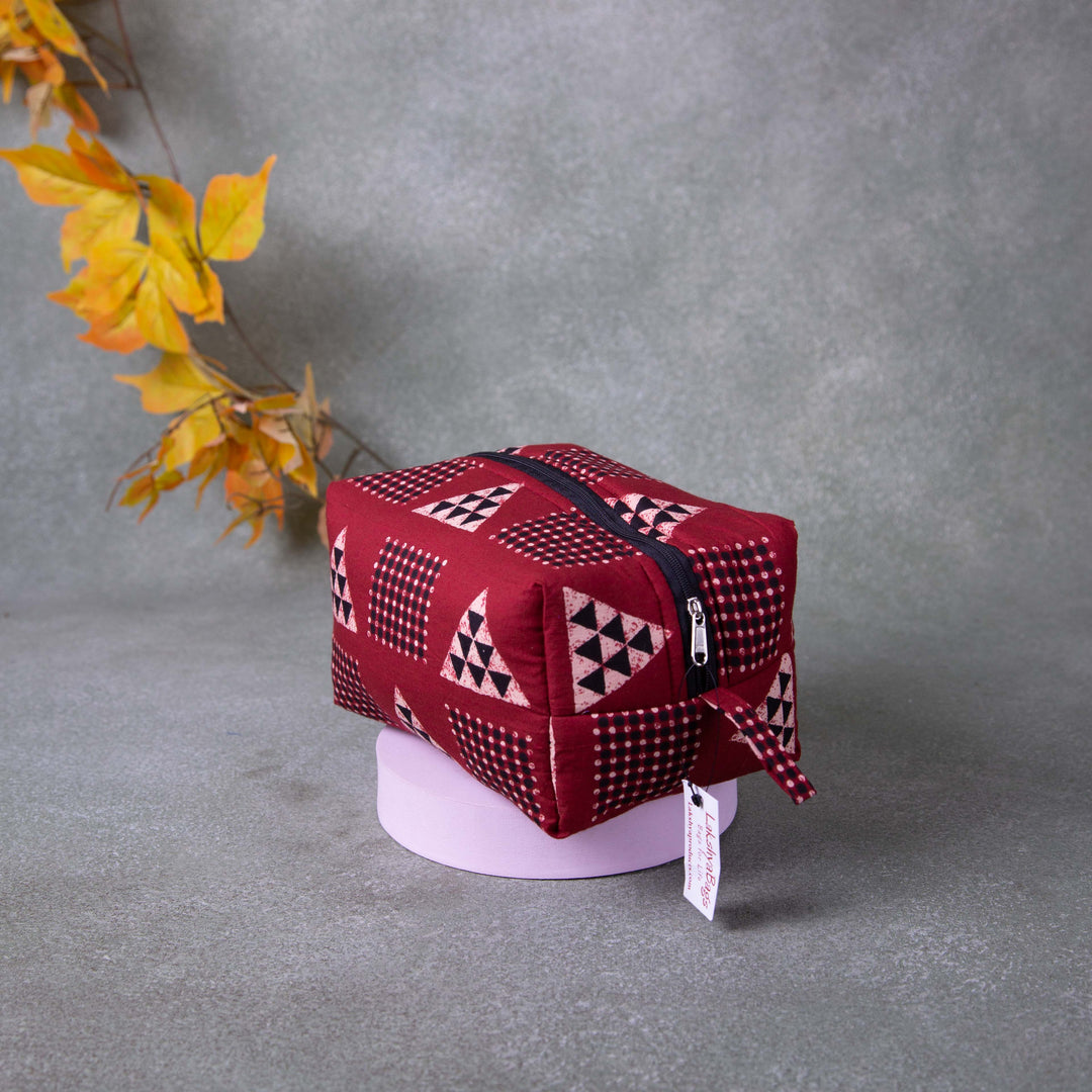 Vanity Pouch Maroon with Sandal and Black Triangle Design.