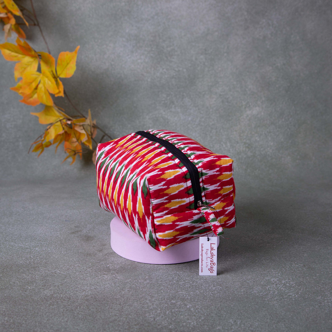 Vanity Pouch Red Colour with Yellow White and Green Zig Zag Design.