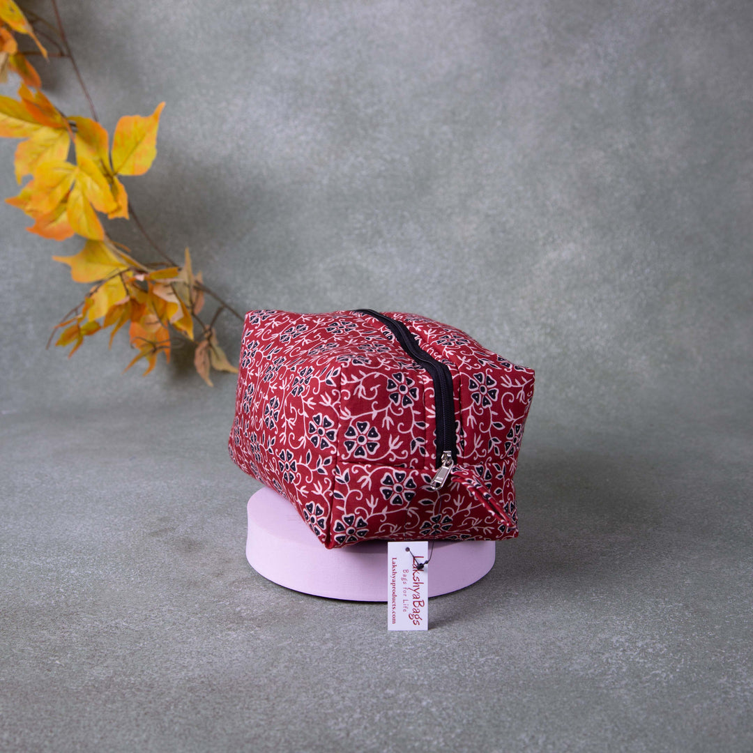 Vanity Pouch Maroon Colour with Small White and Black Flower Printed.