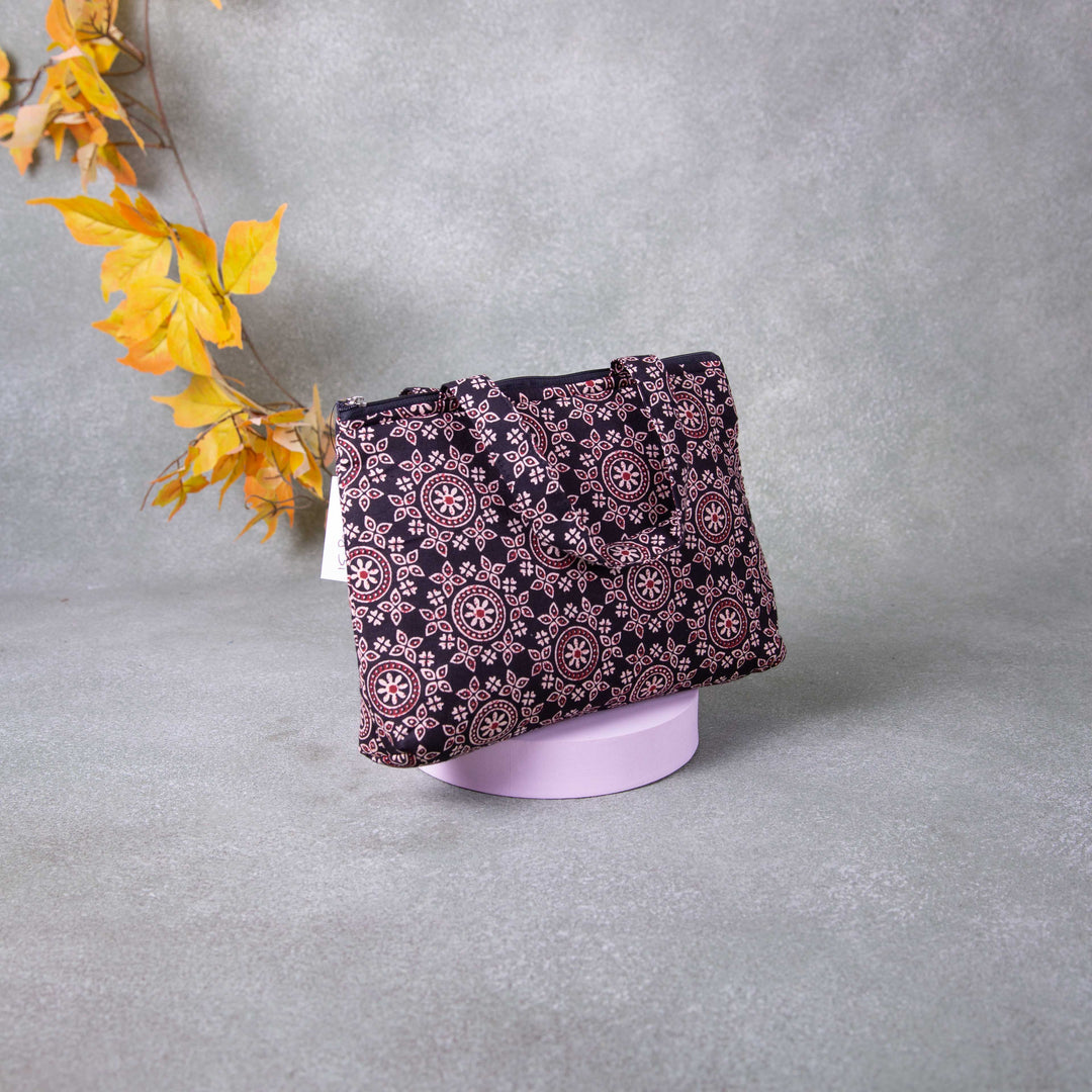 Bristlefront everyday handy bags Black Colour with Big Sandal Flower Printed Design.