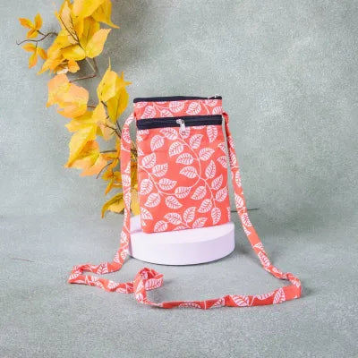 Daily Sling Orange with White Leaf Design.