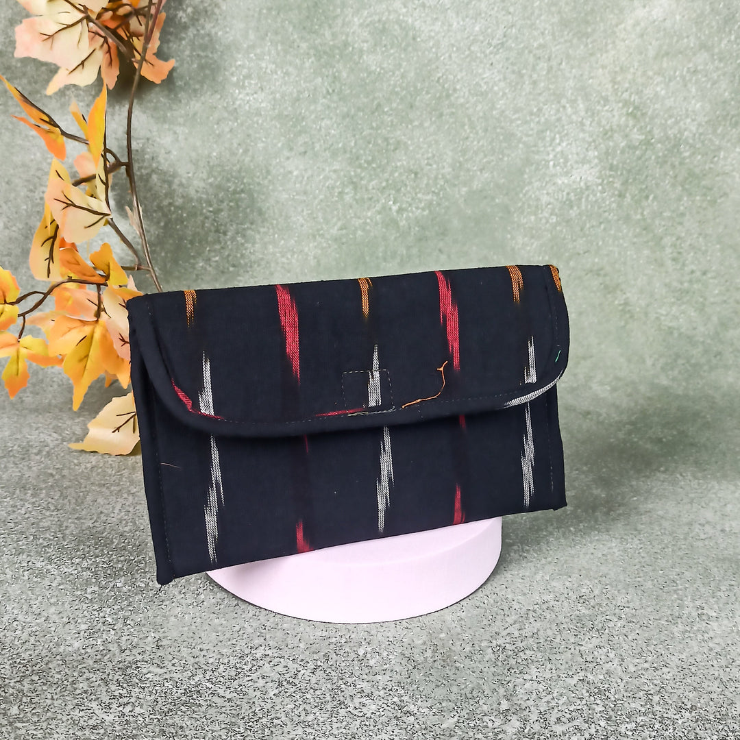 Ikat Clutch Black Colour with Red Prints.