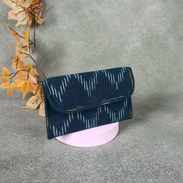 Ikat Clutch Dark Green Colour With White Line Design.