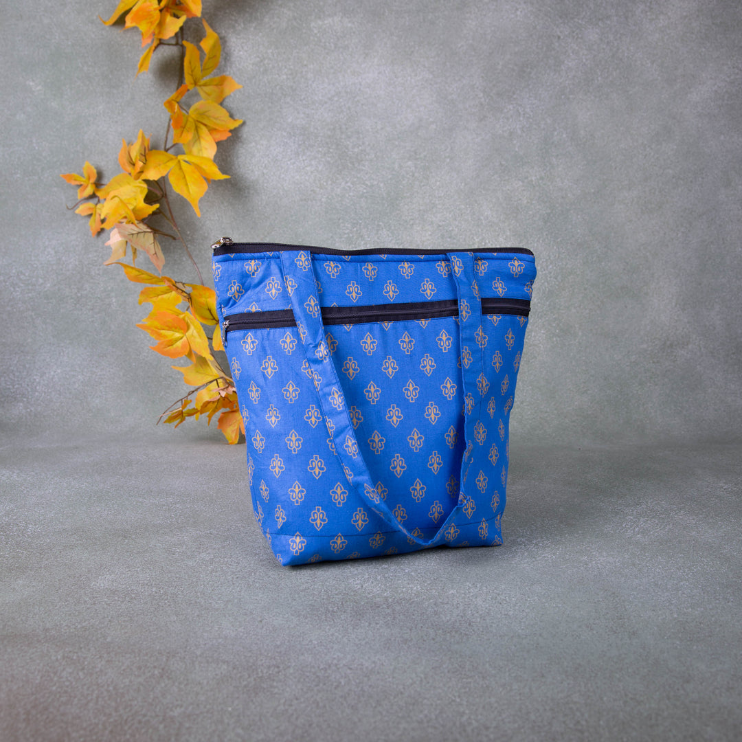 Medium Size Handbag Blue with Small Golden Colour Flower Design.