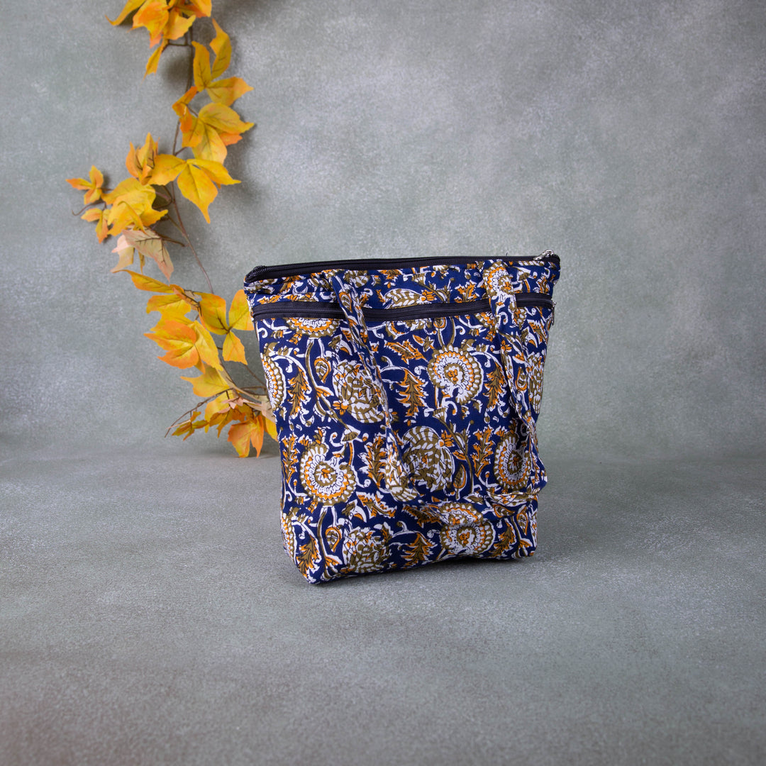 Medium Size Handbag Blue with Mustered Flower Design.