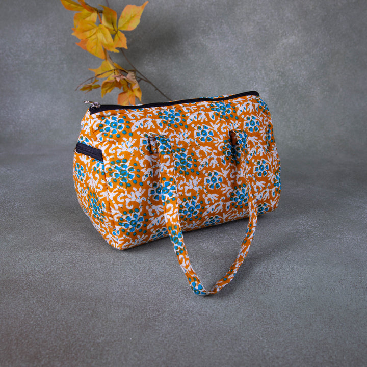 Barrel Handbags Yellow with Blue Flower Design.