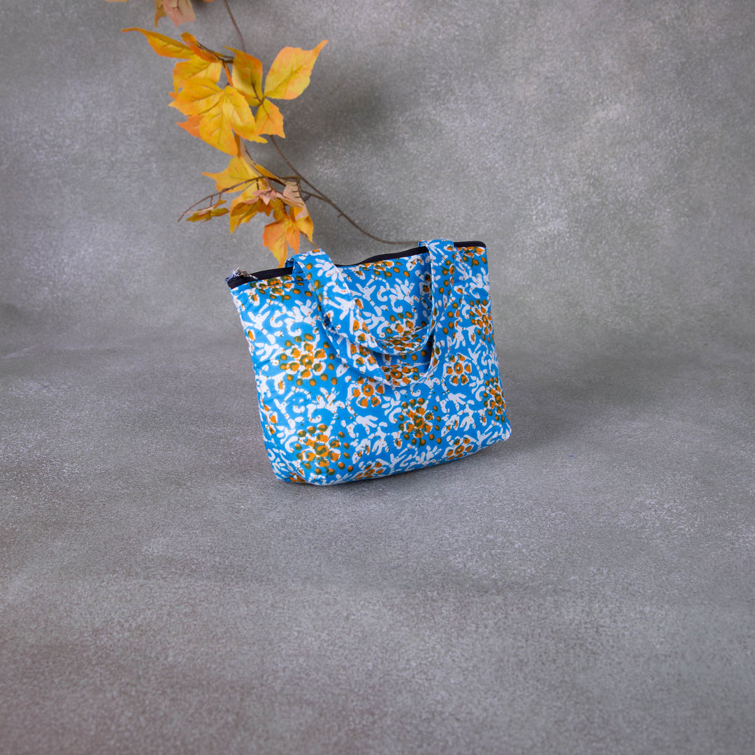 Bristlefront everyday handy bags Blue Colour with Mustered Flower Design.