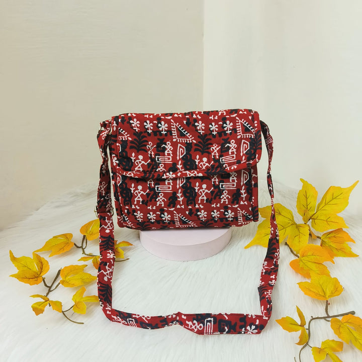 Multizipper Sling 4 Zips Red with White and Black Trible Design.