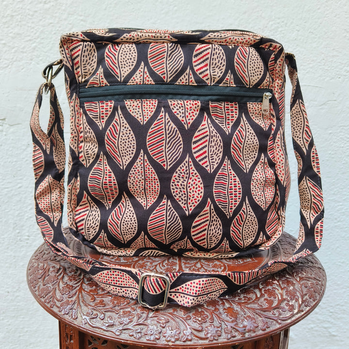 Xtra Sling bag black with red leaf print