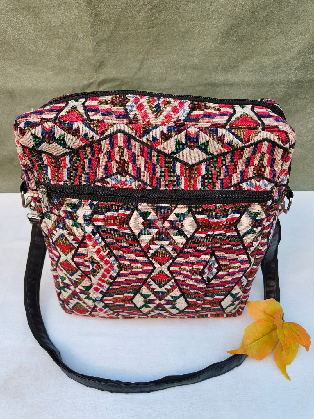 Lap sling cum backpack multicolor with Folk Loom Print