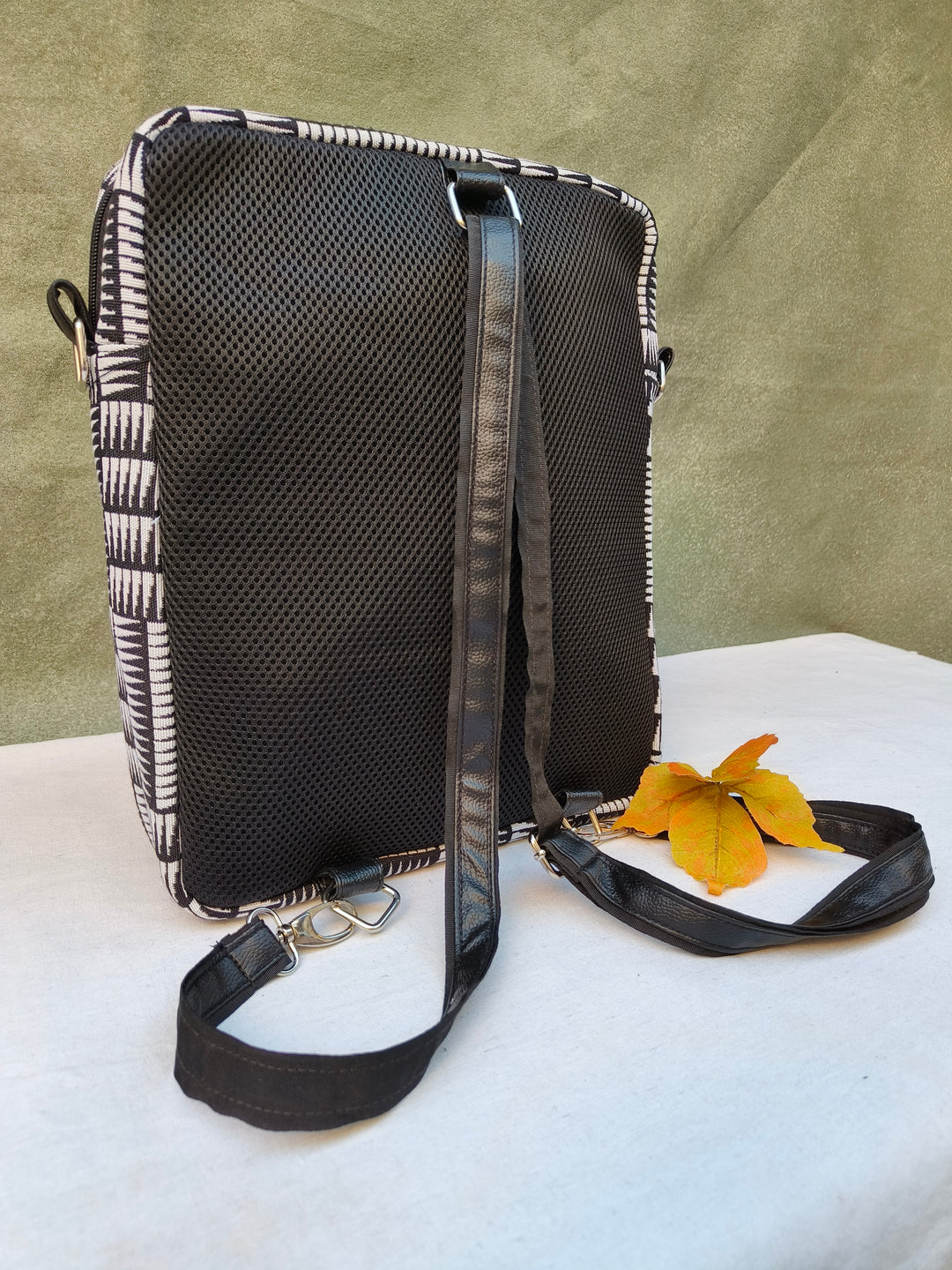 Lap sling cum backpack Black with white strip print