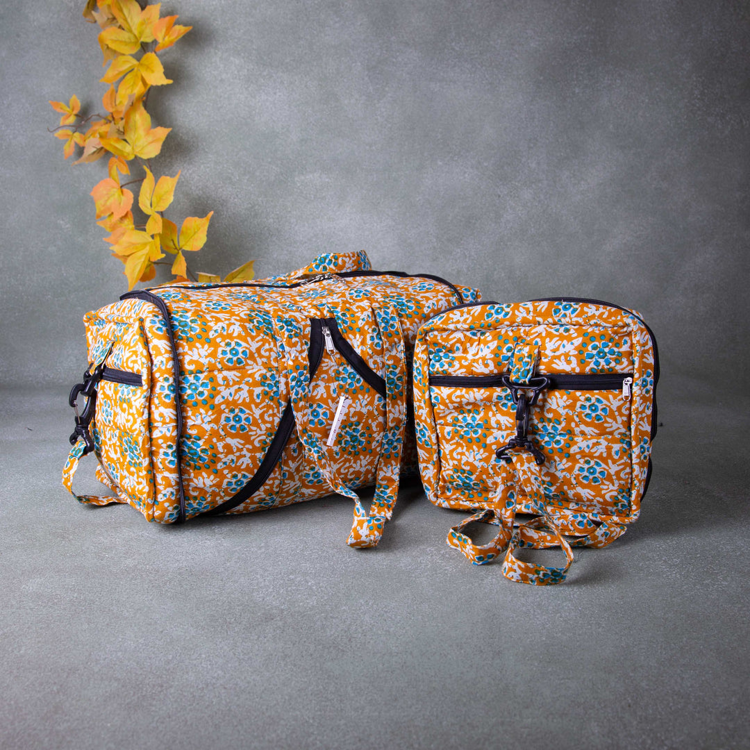 Expandable Travel Bag Orange Colour with Blue and White Flower Printed Design.