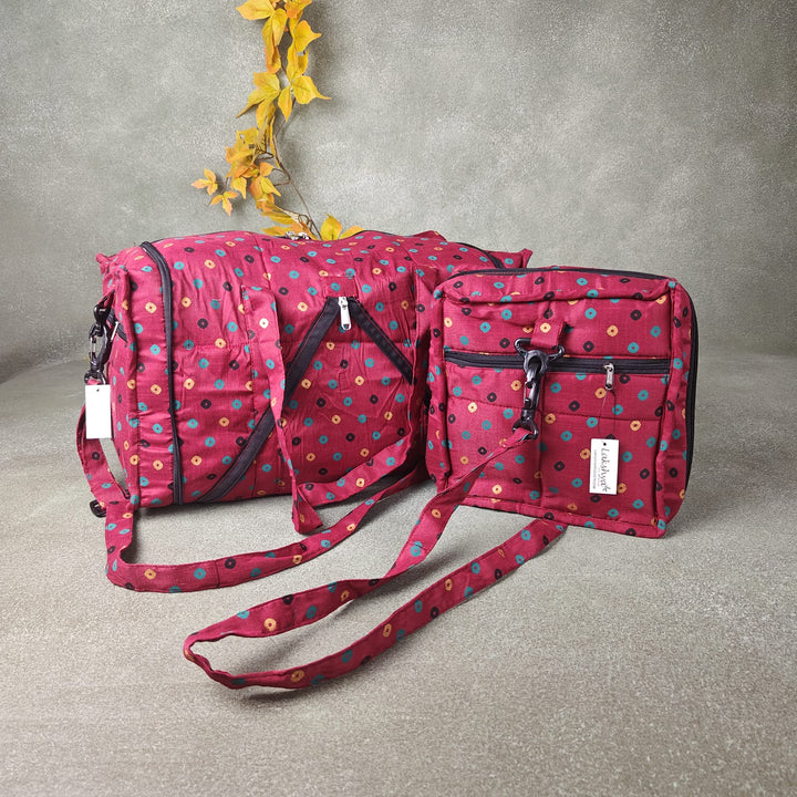 Expandable Travel Bag Maroon Colour with Small Green Black and Gold Dots Design.