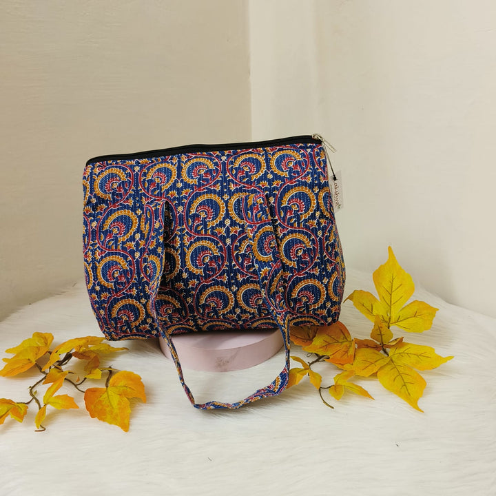 Barrel Handbags Blue with Mustered Design.