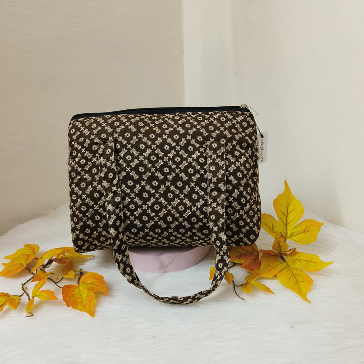 Barrel Handbags Brown with Arabesque Prints.