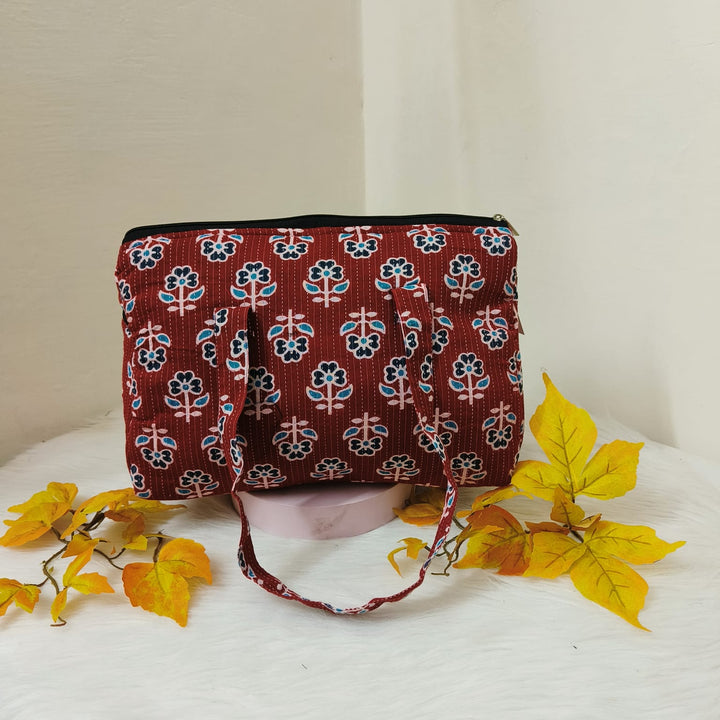 Barrel Handbags Red with Blue Leaf Design.