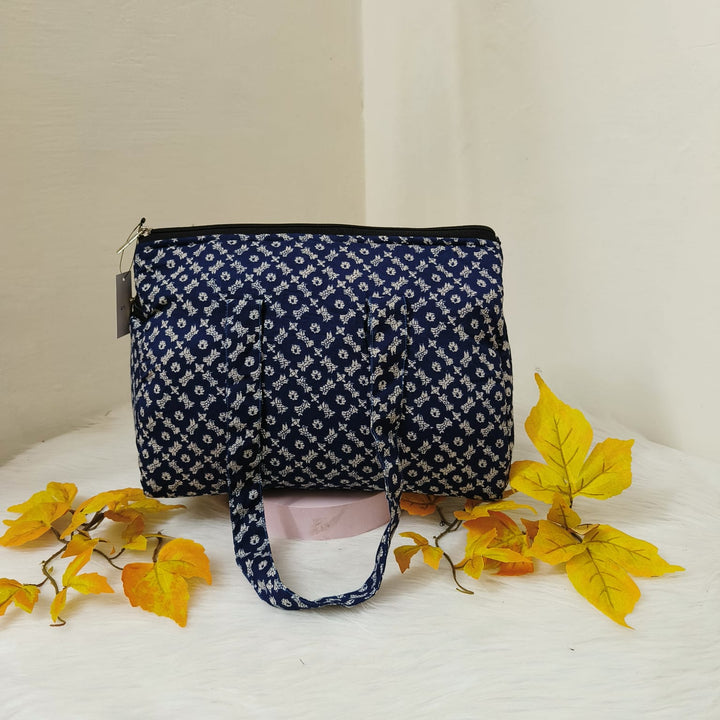 Barrel Handbags Blue with White Arabesque Prints.