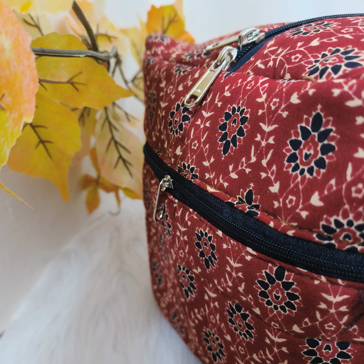 Rectangle Travel Bag Maroon with Black Floral Design.