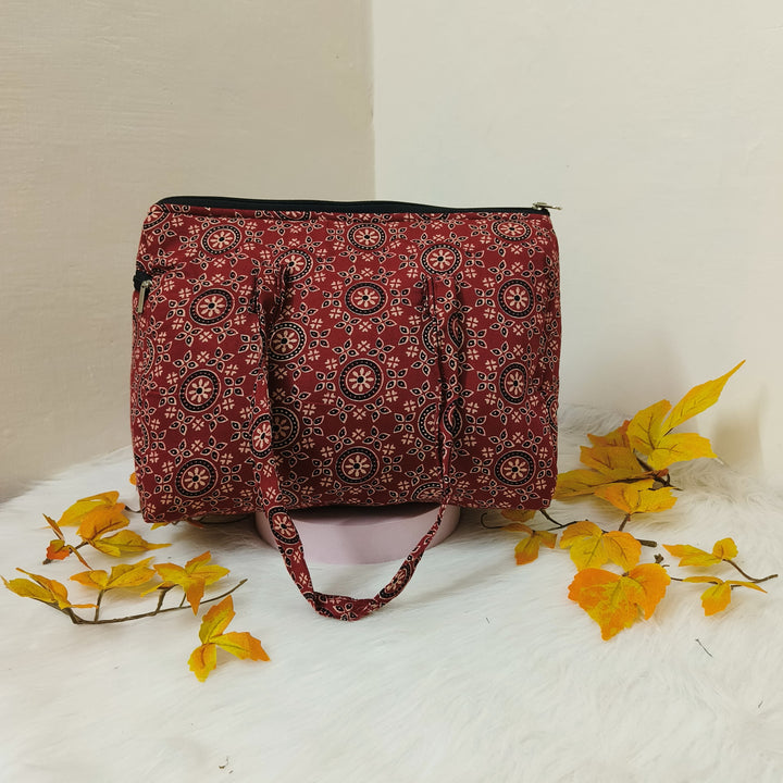 Barrel Handbags Maroon with Golden Flower Design.