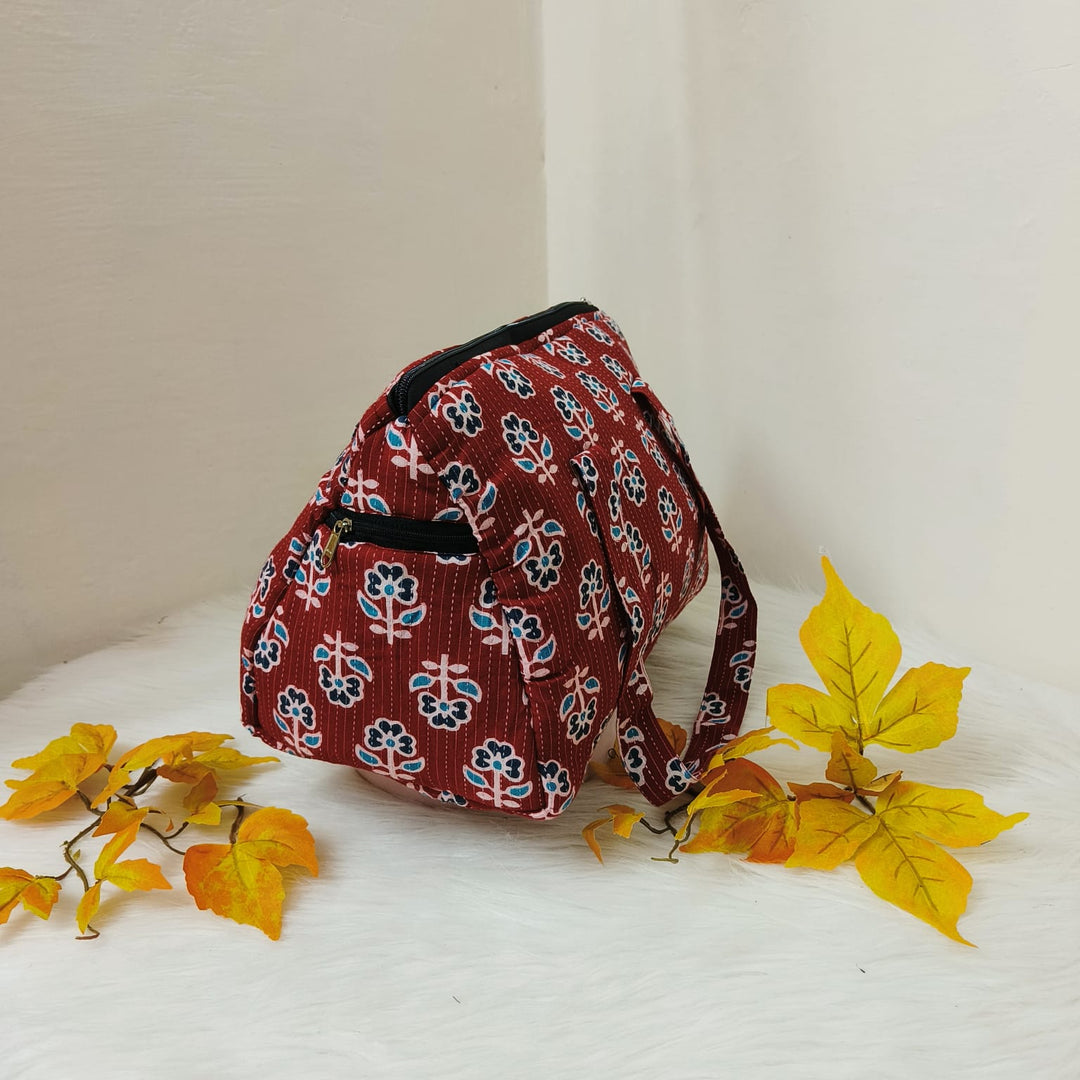 Barrel Handbags Red with Blue Leaf Design.